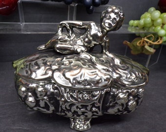 2311 USA Ceramic Cherub Footed Silver Colored Cask 7.5" x 4" x 6.5" Tall Trinket Box with Cherub On Lid - Very Good Condition