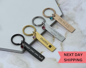 May include: Four personalized keychains with different colored metal tags and charms. The tags are engraved with the text "Come back home quickly!", "08.11.22", "mama", and "create your own luck".