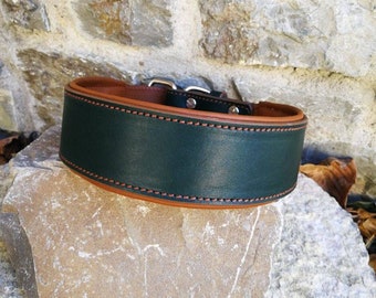 May include: A dark green leather dog collar with brown stitching and silver hardware. The collar is on a brown rock.