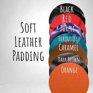 May include: An image showcasing a variety of colored leather swatches, including black, red, purple, turquoise, caramel, dark brown, and orange. The text "SOFT LEATHER PADDING" is displayed on the left side of the image.