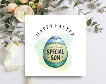 May include: A white Easter card featuring the words "HAPPY EASTER" above a decorated egg. The egg is blue, green, and yellow with the words "SPECIAL SON". The card is surrounded by floral and greenery elements.
