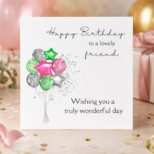 May include: A square white greeting card featuring the text Happy Birthday to a lovely friend and Wishing you a truly wonderful day. A cluster of illustrated balloons in shades of pink, green, silver, and glittery textures is printed on the left.