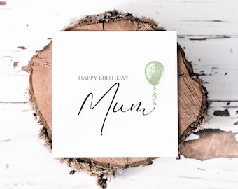 May include: A white card with the text "Happy Birthday Mum" in black script. A green balloon with silver glitter is floating above the text.
