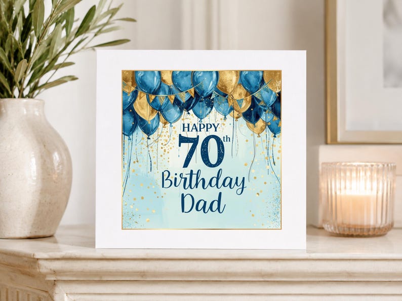 May include: A square greeting card featuring a light blue background with gold glitter accents and a cluster of dark blue and gold balloons at the top. The text reads Happy 70th Birthday Dad in dark blue lettering centered on the card.