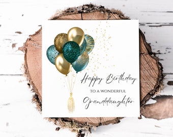 May include: A white card with a birthday greeting that reads "Happy Birthday to a Wonderful Granddaughter". The card is decorated with a cluster of teal and gold balloons.