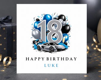 May include: A square birthday greeting card featuring the number 18 in large silver font, surrounded by blue, black, and silver balloons, a silver sports car, a game controller, and a champagne flute. The text reads HAPPY BIRTHDAY LUKE.