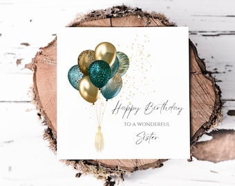 May include: A birthday card featuring a design of gold and teal balloons with gold glitter. The card reads "Happy Birthday to a Wonderful Sister".