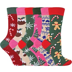 May include: A set of six crew socks featuring various holiday patterns including candy canes, snowflakes, Christmas puddings, pine trees, gingerbread men, and geometric shapes in red, green, pink, beige, and blue color palettes.