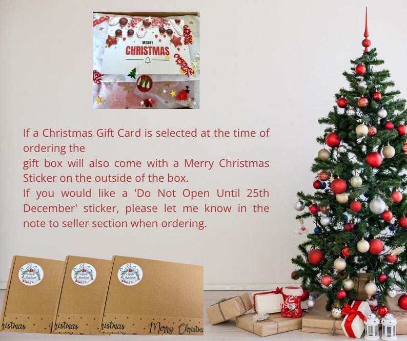 May include: A Christmas tree decorated with red, gold, and silver ornaments stands next to three brown cardboard gift boxes. Each box features a circular sticker and the text Merry Christmas printed along the bottom edge.
