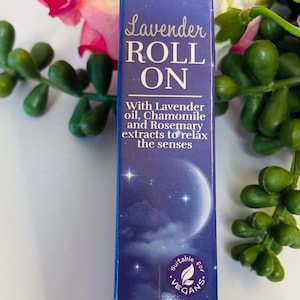 May include: A blue box of DERMAV10 Lavender Roll On, with text that reads "With Lavender oil, Chamomile and Rosemary extracts to relax the senses." The box is suitable for vegans and perfect to use before bedtime.