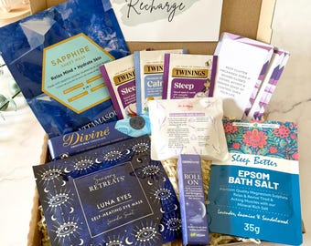 May include: A gift box containing a Sapphire sheet mask, Twinings tea bags, a Divine chocolate bar, a Sensory Retreats Luna Eyes self-heating eye mask, a Dermavio lavender roll-on, a lavender bath bomb, and Sleep Better Epsom bath salt.
