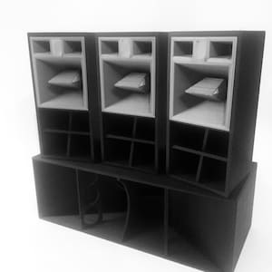 May include: A black and white model of a sound system, featuring three speaker boxes stacked on a larger base. Each speaker box has a unique design with internal components visible. The overall design is geometric and modern.