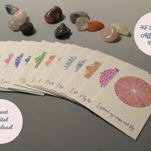 May include: A set of 48 printable affirmation cards featuring colorful mandala designs. Each card has a different affirmation printed on it, such as "I am", "My life", and "I spread my wings and fly".