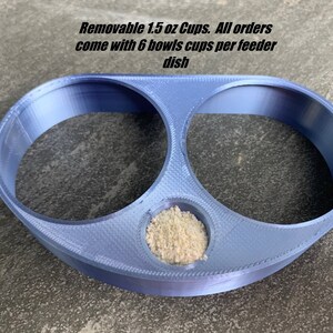 May include: A blue plastic feeder dish with two removable 1.5 ounce cups. The feeder dish is designed to hold six cups total. Removable 1.5 oz Cups. All orders come with 6 bowls cups per feeder dish.