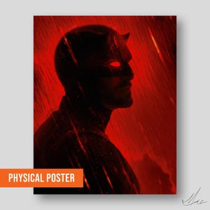 Op de afbeelding: Een rood en zwart poster met een silhouet van een personage met hoorns en een masker, tegen een rode achtergrond met regenachtige strepen. De woorden "PHYSICAL POSTER" staan in een oranje rechthoek onderaan.