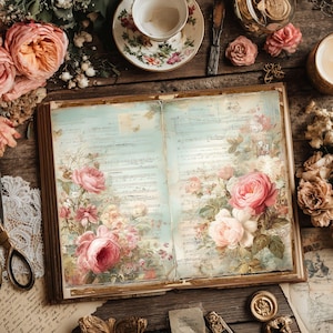 May include: An open vintage book with floral illustrations and handwritten script. The pages feature pink roses and other flowers against a light blue background. A teacup, saucer, and other vintage items surround the book.