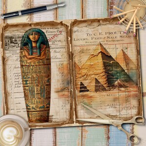 May include: An open vintage ledger book with a hand-drawn illustration of an Egyptian sarcophagus on the left page and a hand-drawn illustration of the pyramids of Giza on the right page. The pages are filled with handwritten text and numbers.