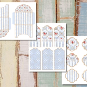May include: Printable set of blue and white gift tags and boxes with a floral pattern. The tags have a variety of shapes, including circles, rectangles, and ovals. The boxes are designed to be folded and assembled.