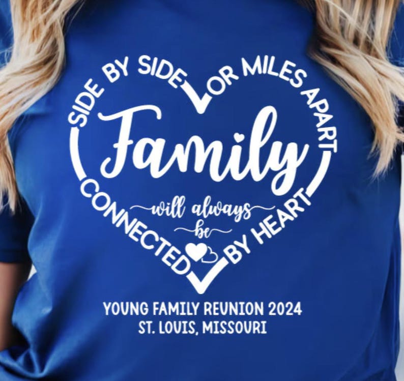 May include: A royal blue t-shirt with a white heart design that says "Side by side or miles apart, family will always be connected by heart". The text "Young Family Reunion 2024, St. Louis, Missouri" is printed below the heart.
