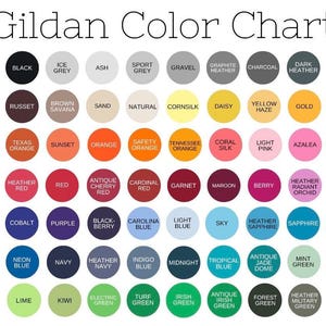 May include: Gildan Color Chart showing a variety of colors in a grid format. The colors are arranged in rows and columns, with each color represented by a circle. The colors include white, black, ice grey, ash, sport grey, gravel, graphite heather, charcoal, dark heather, tweed, dark chocolate, russet, brown savana, sand, natural, cornsilk, daisy, yellow haze, gold, old gold, antique orange, texas orange, sunset, orange, safety orange, tennessee orange, coral silk, light pink, azalea, safety pink, heliconia, heather red, red, antique cherry red, cardinal red, garnet, maroon, berry, heather radiant orchid, violet, lilac, cobalt, purple, black-berry, carolina blue, light blue, sky, heather sapphire, sapphire, antique sapphire, royal, neon blue, navy, heather navy, indigo blue, midnight, tropical blue, antique jade dome, mint green, neon green, safety green, lime, kiwi, electric green, turf green, irish green, antique irish green, forest green, heather military green, military green.