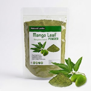 May include: A clear plastic stand-up pouch filled with green mango leaf powder. The label reads Natural Lanka Mango Leaf (Mangifera indica) POWDER, featuring an illustration of green mango leaves and a small pile of the powder.