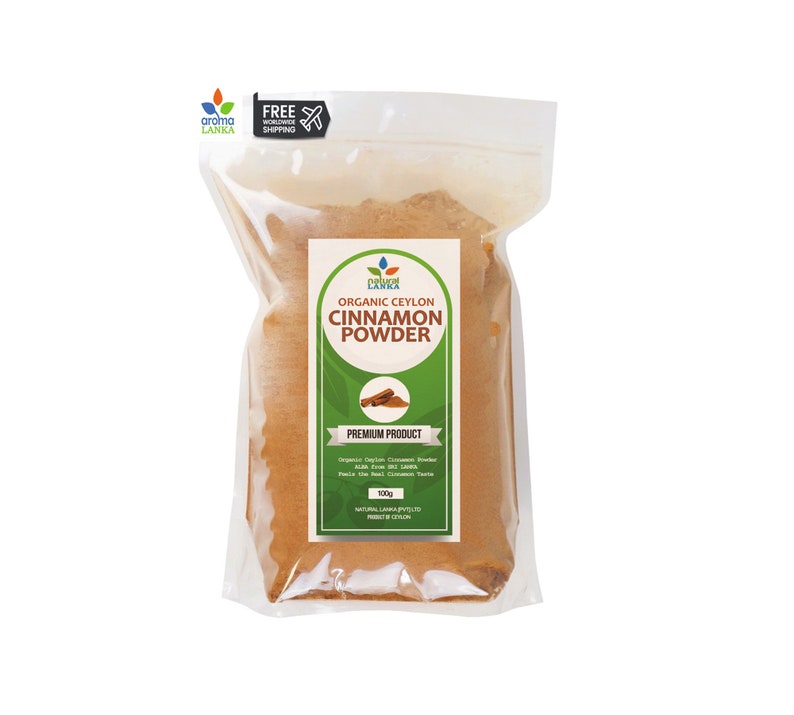 May include: A clear plastic bag filled with brown cinnamon powder. The bag has a label that says "Organic Ceylon Cinnamon Powder" and "Premium Product". The label is green with white text and a small image of a cinnamon stick.