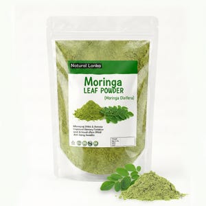 May include: A clear stand-up pouch filled with vibrant green Moringa leaf powder. The label features the text Natural Lanka, Moringa LEAF POWDER, and Moringa Oleifera, alongside an illustration of a mound of powder and fresh green leaves.