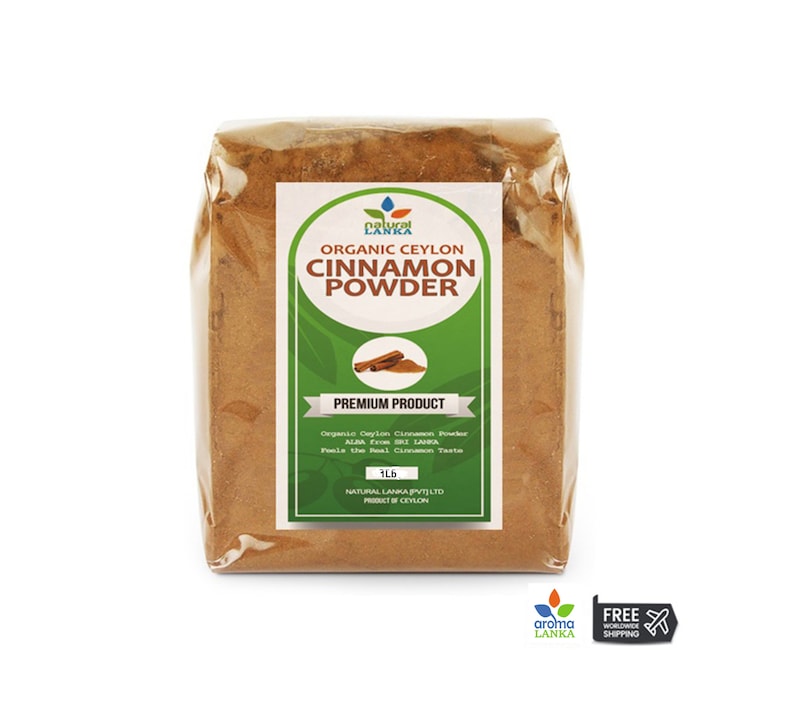 May include: A brown bag of organic Ceylon cinnamon powder. The bag has a green label with the words "Organic Ceylon Cinnamon Powder" and "Premium Product". The label also includes the text "1 lb" and "Natural Lanka Pvt Ltd, Product of Ceylon".