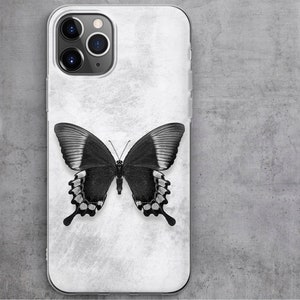 May include: A white phone case with a black butterfly design. The butterfly has white accents on its wings.