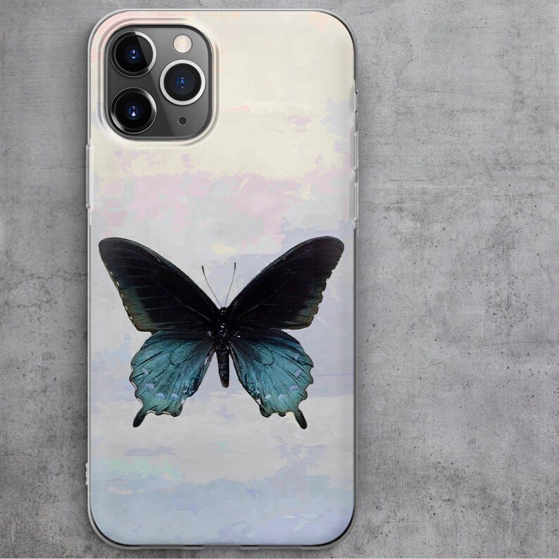 May include: A clear phone case with a watercolor-style background featuring a blue and black butterfly.