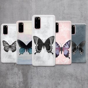 May include: Five different phone cases with butterfly designs. The cases are all clear and have a textured background. The butterflies are all different colors and patterns.