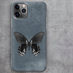 May include: A clear phone case with a blue background and a black and white butterfly illustration.