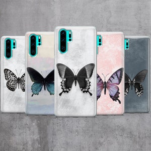 May include: Five different phone cases with butterfly designs. The cases are clear and show a variety of butterfly designs on a white, pink, blue, and gray background.
