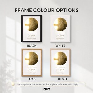 May include: Four rectangular wall frames in black, white, oak, and birch finishes. Each frame contains a white print featuring a gold circular star map, the text "BORN UNDER THIS SKY," a name, and date details. The text "FRAME COLOUR OPTIONS" appears above.