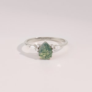 14k solid white gold 6x8mm pear cut natural aquatic green moss agate engagement ring with tiny G Colour SI Clarity genuine diamond accent side stones on a white background