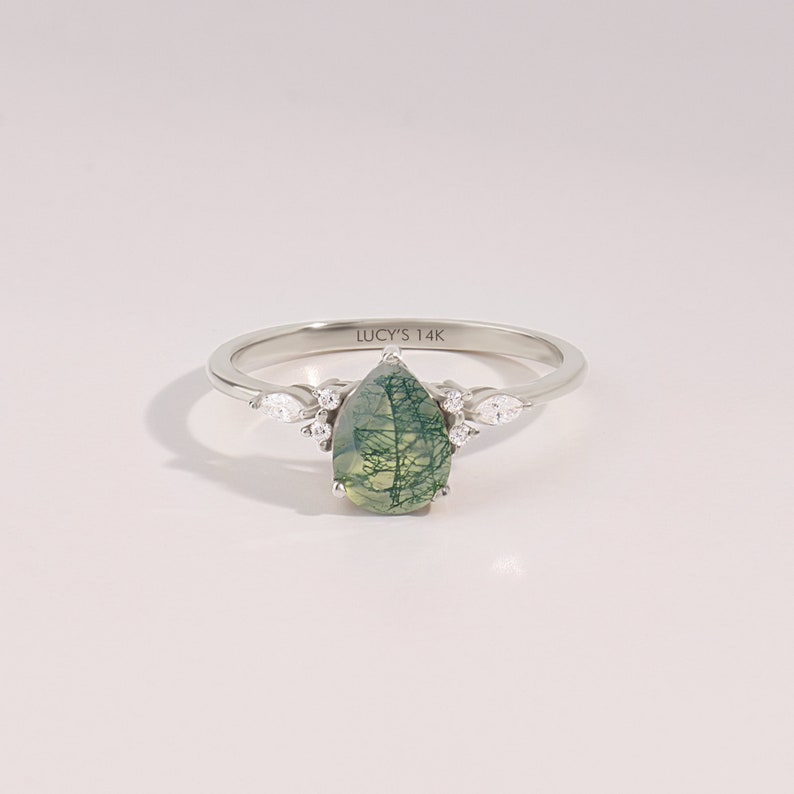 14k solid white gold 6x8mm pear cut natural aquatic green moss agate engagement ring with tiny G Colour SI Clarity genuine diamond accent side stones on a white background