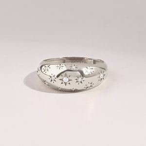 14k Solid white Gold scattered stars Dome statement Ring with tiny round G Colour SI Clarity genuine diamonds on a white background