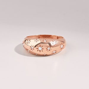 14k Solid rose Gold scattered stars Dome statement Ring with tiny round G Colour SI Clarity genuine diamonds on a white background