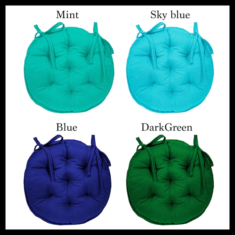 May include: Four round chair cushions in different colours: mint green, sky blue, blue, and dark green. Each cushion has a tied bow and a buttoned design.