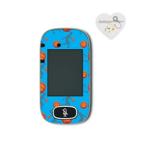 May include: A blue phone case featuring a basketball and player design. The case has a microphone icon on the front.