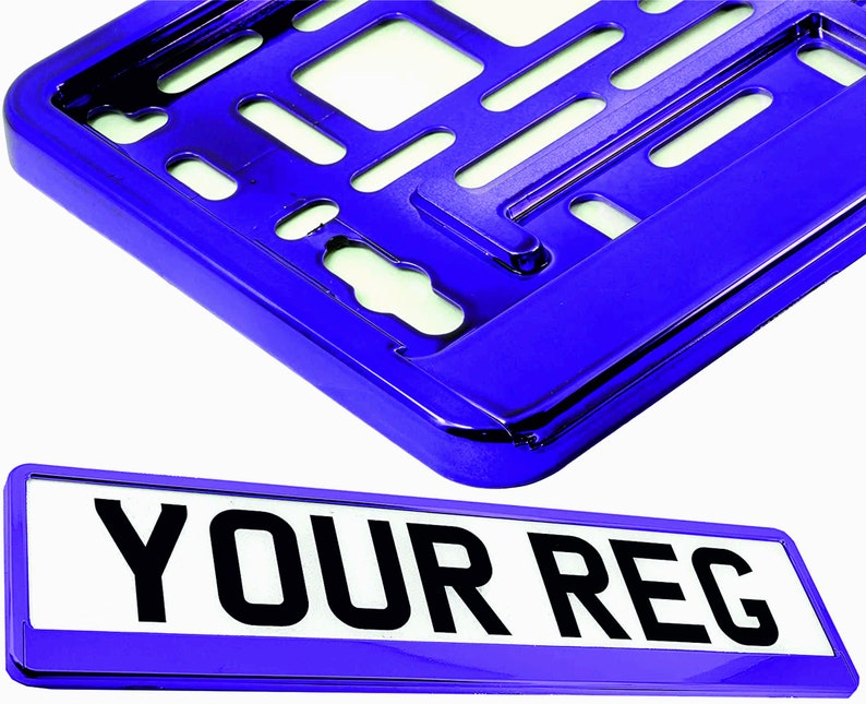 May include: A shiny blue license plate frame and a matching license plate. The license plate has the text "YOUR REG" in bold black letters on a white background. The frame has a glossy finish.