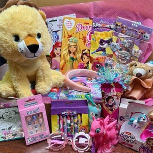 May include: A collection of children's toys and accessories, including a plush lion, princess-themed items, stickers, and a pink toy pony. Other items include a headband, nail art, and a pair of pink sunglasses.