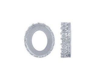 May include: Two silver oval-shaped bezel settings for jewelry making. The bezels have a decorative, scalloped edge.