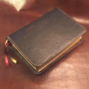 Black sheepskin leather ESV Study Bible with honey brown perimeter stitching and two ribbons