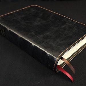 Black sheepskin leather Super Giant Print Reference Bible with honey brown perimeter stitching and two ribbons