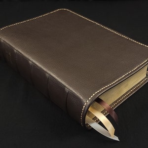 Chocolate brown cowhide leather Life Application Study Bible, Large Print with tan perimeter stitching and three ribbons