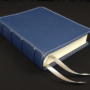 Blue cowhide leather CSB She Reads Truth Bible with silver perimeter stitch and two silver ribbons