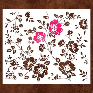 May include: A floral stencil design featuring brown stems, leaves, and flowers on a white background. Two bright pink flowers are prominent, with various sizes of brown flowers and buds throughout the design. The stencil is ideal for crafts and DIY projects.