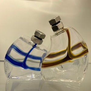 Kosta Boda pair of “Macho” bottles by Kjell Engman