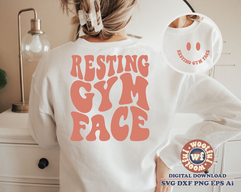 May include: White sweatshirt with the text "RESTING GYM FACE" in pink retro font. The text is centred on the sweatshirt.